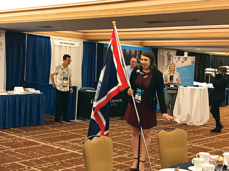 Katelyn Mary Skaggs, reporter, Leader Publications, Festus, Missouri, carries the Wyoming flag for the Adelman family during the Friday morning opening breakfast of convention. Katelyn Mary Skaggs, reporter, Leader Publications, Festus, Missouri, carries the Wyoming flag for the Adelman family during the Friday morning opening breakfast of convention.