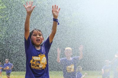 FEATURES: Leland elementary student Jordan Salinas enjoys some refreshing water courtesy of the Leland Township Fire Department during the 2023 Leland Fun Run. (June 8, 2023) (Brian Freiberger | Leelanau Enterprise, Lake Leelanau, Michigan) FEATURES: Leland elementary student Jordan Salinas enjoys some refreshing water courtesy of the Leland Township Fire Department during the 2023 Leland Fun Run. (June 8, 2023) (Brian Freiberger | Leelanau Enterprise, Lake Leelanau, Michigan)