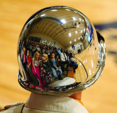 The faces of tomorrow’s leaders were reflected in the helmet of American Legion Color Guard member Jim Schaffer during the Veteran’s Day Program that was held at the Leola School. (Nov. 18, 2021) (Jeremy Cox | McPherson County Herald, Leola, South Dakota)