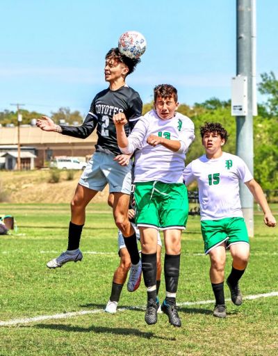 Daniel Perez (No. 2) out jumps a Pearsall player and heads the ball towards a teammate during the first half of the District 28-4A match between the Uvalde Coyotes and the Pearsall Mavericks. (March 16, 2023) (Pete Luna | Uvalde (Texas) Leader-News) Daniel Perez (No. 2) out jumps a Pearsall player and heads the ball towards a teammate during the first half of the District 28-4A match between the Uvalde Coyotes and the Pearsall Mavericks. (March 16, 2023) (Pete Luna | Uvalde (Texas) Leader-News)