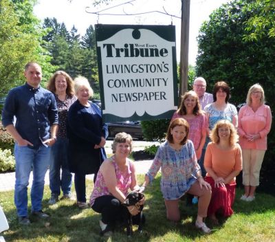 Left to Right: (Standing) Michael Izzo, editor; Ellen Whitney, graphic artist; Karen Trachtenberg, production manager; Ellen Lazer, editorial associate; Garry DeYoung, advertising representative; Grisel Cardona, production associate/typesetter; Ellen Harte, business manager; (Kneeling); Jenny Cone Chciuk, publisher, advertising director; Georgie, chief morale officer; Nancy Diner, retired editor, now proofreader; Christine Sablynski, managing editor.