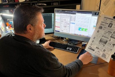 Steve Johnston, pre-press manager at the Powell (Wyoming) Tribune, works on production.