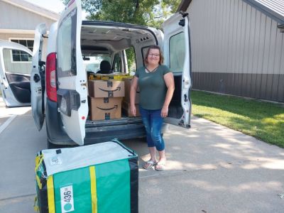 Tipton Times reporter Tara Alumbaugh loads up the newspaper s van to begin delivering Amazon packages to customers in her community. (Photo provided by Trevor Vernon) Tipton Times reporter Tara Alumbaugh loads up the newspaper s van to begin delivering Amazon packages to customers in her community. (Photo provided by Trevor Vernon)