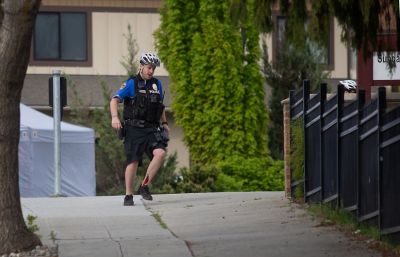 NEWS — Wenatchee police officer Brian Hewitt, shot in the leg, runs for cover near the Living Hope Community Church on the corner of Chelan and Palouse Streets Saturday morning, May 7, 2022. He and two other officers discharged their weapons, killing Alexander J. White, 36, East Wenatchee, in the altercation who police say was shooting at the church. (Pub Aux Photo Contest judges also gave a nod to Seabrook s feature photo entry capturing the delight and curiosity of local fouth graders on a field trip through a skylight.) (Don Seabrook | The Wenatchee (Washington) World) NEWS — Wenatchee police officer Brian Hewitt, shot in the leg, runs for cover near the Living Hope Community Church on the corner of Chelan and Palouse Streets Saturday morning, May 7, 2022. He and two other officers discharged their weapons, killing Alexander J. White, 36, East Wenatchee, in the altercation who police say was shooting at the church. (Pub Aux Photo Contest judges also gave a nod to Seabrook s feature photo entry capturing the delight and curiosity of local fouth graders on a field trip through a skylight.) (Don Seabrook | The Wenatchee (Washington) World)