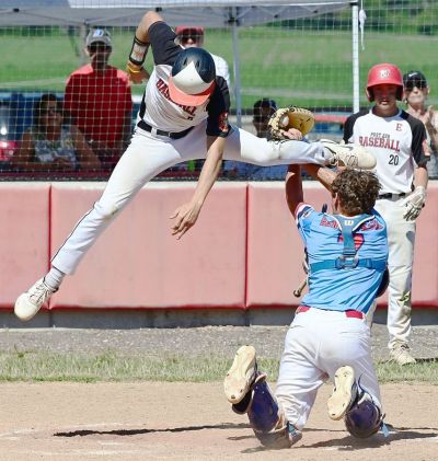 Washington Post 218 Junior Legion catcher Noah Hendrickson tags out Elsberry Post 226 Red runner Walker Chandler at the plate Sunday during the Ninth District Tournament winner-take-all game. Chandler tried to hurdle Hendrickson, but was tagged out. Elsberry won the game, and the Ninth District title, 13-9.  [Bill Battle | The Missourian (Washington Missouri)]