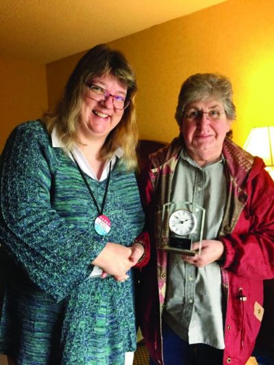 Terry Hamberg (left) congratulates Jerri Stoner on receiving the Washington Newspaper Publishers Association s 2016 Dixie Lee Bradley Award at the annual WNPA convention. The Dixie Lee Bradley Award is presented to one newspaper industry employee each year for “consistent, quality work over a considerable time period in any facet of the community newspaper industry.” Oahe Publishing Corporation is the parent company of the Northern Kittitas County Tribune and owned by Jana Stoner, president, Terry Hamberg, vice president, and Jerri Stoner, secretary/treasurer. Terry Hamberg (left) congratulates Jerri Stoner on receiving the Washington Newspaper Publishers Association s 2016 Dixie Lee Bradley Award at the annual WNPA convention. The Dixie Lee Bradley Award is presented to one newspaper industry employee each year for “consistent, quality work over a considerable time period in any facet of the community newspaper industry.” Oahe Publishing Corporation is the parent company of the Northern Kittitas County Tribune and owned by Jana Stoner, president, Terry Hamberg, vice president, and Jerri Stoner, secretary/treasurer.