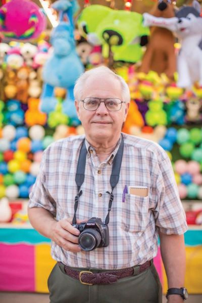 A pre-pandemic photo of Bill Blauvelt shooting photos at a local carnival in Superior. A pre-pandemic photo of Bill Blauvelt shooting photos at a local carnival in Superior.