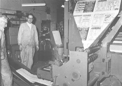 Bill Blauvelt (center) shows off the Superior Express press room soon after the press was installed. Lyle McCammon (far left) promoted the idea that the newspaper needed its own press. Bill Blauvelt (center) shows off the Superior Express press room soon after the press was installed. Lyle McCammon (far left) promoted the idea that the newspaper needed its own press.